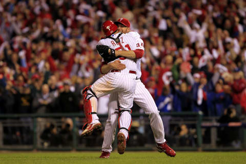 PHILADELPHIA – OCTOBER 06: Roy Halladay #34 and Carlos Ruiz #51 of the Philadelphia Phillies celebrate Halladay’s no-hitter and the win in Game 1 of the NLDS against the Cincinnati Reds at Citizens Bank Park on October 6, 2010 in Philadelphia, Pennsylvania. The Phillies defeated the Reds 4-0. (Photo by Chris Trotman/Getty Images)