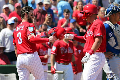 CLEARWATER, FL – MARCH 09: Bryce Harper (3) of the Phillies is all smiles as he congratulates Rhys Hoskins (17) on his homerun during the spring training game between the Toronto Blue Jays and the Philadelphia Phillies on March 09, 2019 at the Spectrum Field in Clearwater, Florida. (Photo by Cliff Welch/Icon Sportswire via Getty Images)