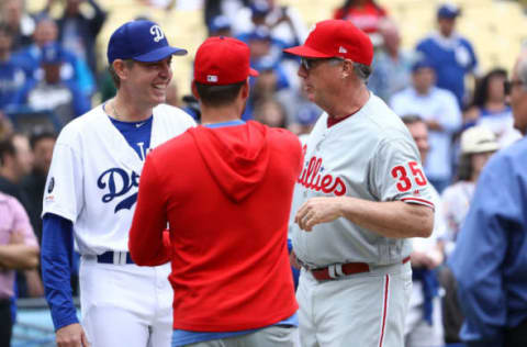 LOS ANGELES, CALIFORNIA – JUNE 01: Former Los Angeles Dodgers Ismael Valdez #59 and bullpen coach Jim Gott #35 of the Philadelphia Phillies share a moment during batting practice prior to the Los Angeles Dodgers Alumni Game at Dodger Stadium on June 01, 2019 in Los Angeles, California. The Dodgers defeated the Phillies 4-3. (Photo by Victor Decolongon/Getty Images)