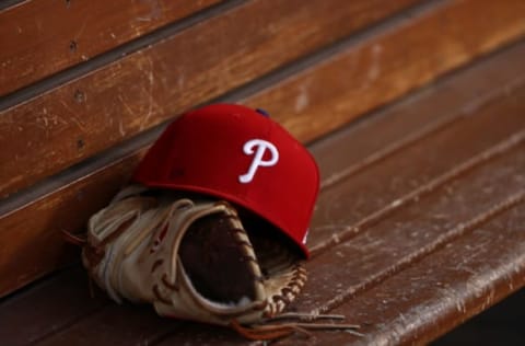 Glove and Philadelphia Phillies hat (Photo by Victor Decolongon/Getty Images)