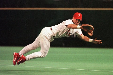 Philadelphia Phillies first baseman Rico Brogna reaches out and snags a line drive hit by Houston Astro Ken Caminiti in the 4th inning of the game in Philadelphia 07 September, 1999. This was the second line drive Brogna caught in a flying dive. AFP PHOTO / Tom MIHALEK (Photo by TOM MIHALEK / AFP) (Photo credit should read TOM MIHALEK/AFP via Getty Images)