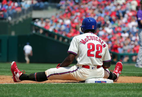 PHILADELPHIA, PA – MAY 19: Andrew McCutchen #22 of the Philadelphia Phillies sits on the second base bag during a game against the Colorado Rockies at Citizens Bank Park on May 19, 2019 in Philadelphia, Pennsylvania. The Phillies won 7-5. (Photo by Hunter Martin/Getty Images)