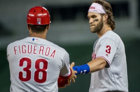 WASHINGTON, DC – SEPTEMBER 26: Philadelphia Phillies right fielder Bryce Harper (3) with first base coach Paco Figueroa (38) during a MLB game between the Washington Nationals and the Philadelphia Phillies, on September 26, 2019, at Nationals Park, in Washington D.C.(Photo by Tony Quinn/Icon Sportswire via Getty Images)