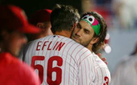 PHILADELPHIA, PA – SEPTEMBER 01: Pitcher Zach Eflin #56 of the Philadelphia Phillies gets a hug from Bryce Harper #3 during the seventh inning of a game against the New York Mets at Citizens Bank Park on September 1, 2019 in Philadelphia, Pennsylvania. The Phillies defeated the Mets 5-2. (Photo by Rich Schultz/Getty Images)