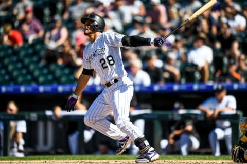 DENVER, CO – SEPTEMBER 1: Nolan Arenado #28 of the Colorado Rockies follows the flight of a sixth inning solo home run against the Pittsburgh Pirates at Coors Field on September 1, 2019 in Denver, Colorado. (Photo by Dustin Bradford/Getty Images)