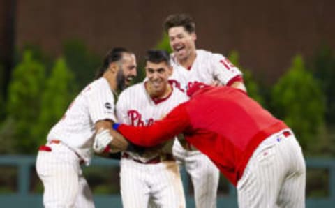 PHILADELPHIA, PA – SEPTEMBER 27: Adam Haseley #40 of the Philadelphia Phillies celebrates with Sean Rodriguez #13, Andrew Knapp #15, and Logan Morrison #8 after hitting a game winning fielders choice in the bottom of the fifteenth inning against the Miami Marlins at Citizens Bank Park on September 27, 2019 in Philadelphia, Pennsylvania. The Phillies defeated the Marlins 5-4 in fifteenth inning. (Photo by Mitchell Leff/Getty Images)