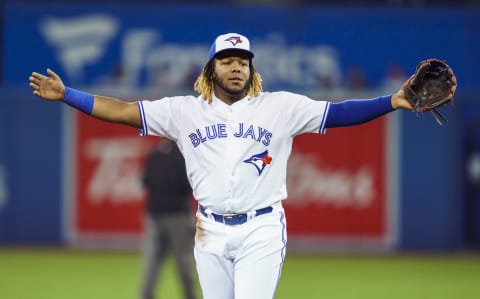 TORONTO, ONTARIO – SEPTEMBER 23: Vladimir Guerrero Jr. #27 of the Toronto Blue Jays gestures against the Baltimore Orioles in the first inning during their MLB game at the Rogers Centre on September 23, 2019 in Toronto, Canada. (Photo by Mark Blinch/Getty Images)