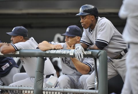 CHICAGO, IL – AUGUST 04: Manager Joe Girardi #28 (C) and Curtis Granderson #14 (R) of the New York Yankees stand in the dugout before the game against the Chicago White Sox at U.S. Cellular Field on August 4, 2011 in Chicago, Illinois. The Yankees won 7-2. Phillies (Photo by Brian D. Kersey/Getty Images)