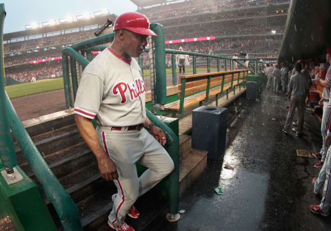 WASHINGTON, DC – AUGUST 21: Third base coach Juan Samuel #12 of the Philadelphia Phillies walks into the dugout during a rain delay against the Washington Nationals in the sixth inning at Nationals Park on August 21, 2011 in Washington, DC. (Photo by Rob Carr/Getty Images)