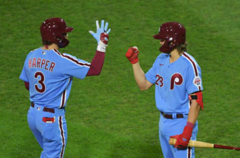 Bryce Harper #3 and Alec Bohm #28 of the Philadelphia Phillies (Photo by Drew Hallowell/Getty Images)