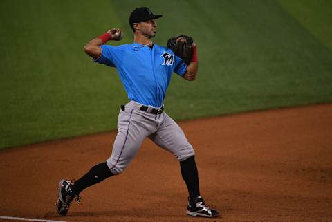 MIAMI, FLORIDA – JULY 17: Sean Rodriguez #13 of the Miami Marlins makes the throw to first base during an intraquad game at Marlins Park at Marlins Park on July 17, 2020 in Miami, Florida. Phillies(Photo by Mark Brown/Getty Images)