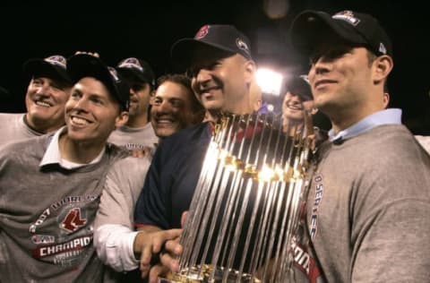 DENVER – OCTOBER 28: Red Sox manager Terry Francona and Theo Epstein, General Manager, pose with the Championship trophy. (Photo by Barry Chin/The Boston Globe via Getty Images)