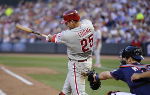 MINNEAPOLIS, MN – JUNE 13: Jim Thome #25 of the Philadelphia Phillies hits a two-run home run as Joe Mauer #7 of the Minnesota Twins catches during the fourth inning on June 13, 2012 at Target Field in Minneapolis, Minnesota. The Phillies defeated the Twins 9-8. (Photo by Hannah Foslien/Getty Images)