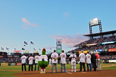 PHILADELPHIA, PA – AUGUST 04: Members of the 1993 Philadelphia Phillies stand with current players during the National Anthem before the game against the Atlanta Braves at Citizens Bank Park on August 4, 2013 in Philadelphia, Pennsylvania. (Photo by Drew Hallowell/Getty Images)