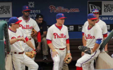 PHILADELPHIA – AUGUST 18: (L-R) Chase Utley, Domonic Brown, Cody Asche, Kevin Frandsen and Darin Ruf of the Philadelphia Phillies stand in the dugout before taking the field before a game against the Los Angeles Dodgers at Citizens Bank Park on August 18, 2013 in Philadelphia, Pennsylvania. The Phillies won 3-2. (Photo by Hunter Martin/Getty Images)