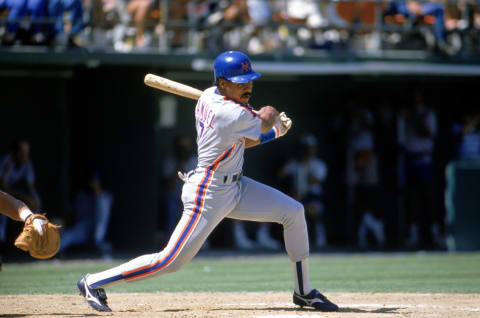 1989: Juan Samuel of the New York Mets swings at the pitch during a game in the 1989 season. (Photo by: Stephen Dunn/Getty Images)