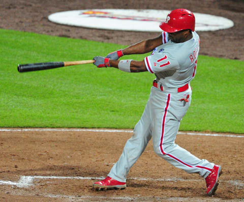 ATLANTA, GA – JULY 19: Jimmy Rollins #11 of the Philadelphia Phillies hits a seventh inning two run home run against the Atlanta Braves at Turner Field on July 19, 2014 in Atlanta, Georgia. (Photo by Scott Cunningham/Getty Images)