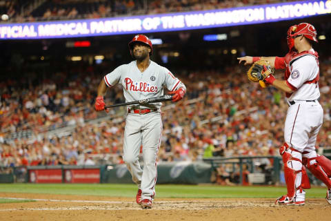 WASHINGTON, DC – SEPTEMBER 05: Jimmy Rollins #11 of the Philadelphia Phillies (L) reacts after striking out in the sixth inning against Stephen Strasburg of the Washington Nationals at Nationals Park on September 5, 2014 in Washington, DC. Also pictured is catcher Wilson Ramos (R) #40 of the Nationals. (Photo by Jonathan Ernst/Getty Images)