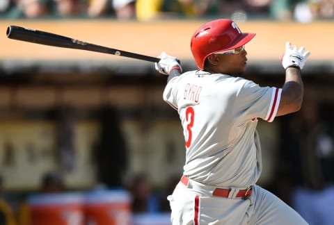 OAKLAND, CA – SEPTEMBER 20: Marlon Byrd #3 of the Philadelphia Phillies hits an rbi single scoring Chase Utley #26 against the Oakland Athletics in the top of the eighth inning at O.co Coliseum on September 20, 2014 in Oakland, California. (Photo by Thearon W. Henderson/Getty Images)