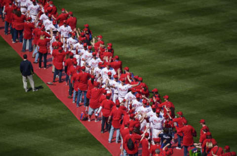 The Philadelphia Phillies march into the stadium (Photo by Drew Hallowell/Getty Images)