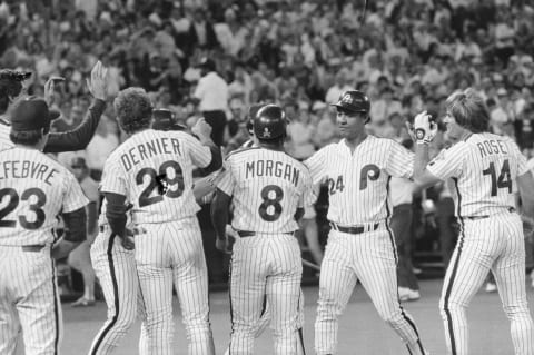 (Original Caption) 6/9/1983-Philadelphia, PA: teammates Joe Morgan and Pete Rose congratulate Phils’ Tony Perez (C) at home plate after he hit a three-run homer to win the game against the Cards 7-4 in the bottom of the 9th in Philadelphia.