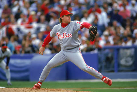 ATLANTA – OCTOBER 11: Pitcher Curt Schilling #38 of the Philadelphia Phillies steps into a pitch during the National League Championship Series Game 5 on October 11, 1993 against the Atlanta Braves at Fulton County Stadium in Atlanta, Georgia. (Photo by Jim Gund/Getty Images)