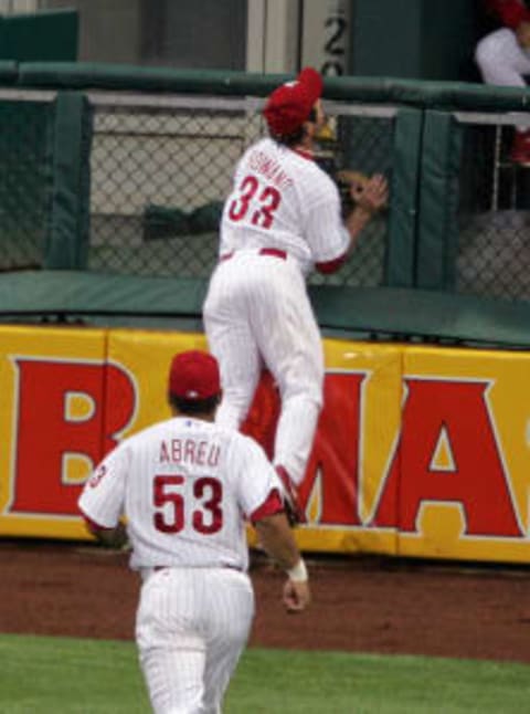 PHILADELPHIA – MAY 11: Aaron Rowand of the Philadelphia Phillies makes a leaping catch and crashes into the outfield wall during the game against the New York Mets at Citizens Bank Park in Philadelphia, Pennsylvania on May 11, 2006. The Phillies defeated the Mets 2-0. (Photo by Miles Kennedy/MLB Photos via Getty Images)