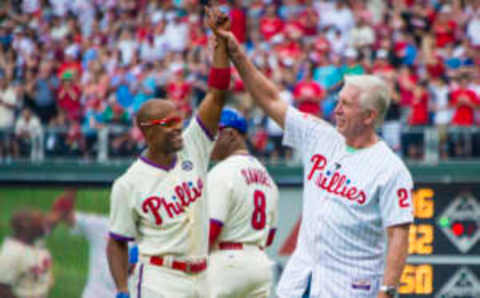 June 14, 2014: Philadelphia Phillies shortstop Jimmy Rollins (11) greeted at first base by Mike Schmidt (20) as Jimmy Rollins passes his career hit record during a Major League Baseball game between the Philadelphia Phillies and the Chicago Cubs at Citizens Bank Park in Philadelphia, Pennsylvania. (Photo by Gavin Baker/Icon SMI/Corbis via Getty Images)