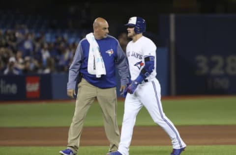 TORONTO, ON – APRIL, 13 Toronto Blue Jays third baseman Josh Donaldson (20) walks off the field with a trainer after legging out a double in the 6th and hurting his right leg.The Toronto Blue Jays played the Baltimore Orioles in MLB action at the Rogers Centre in Toronto.April 13, 2017 Richard Lautens/Toronto Star (Richard Lautens/Toronto Star via Getty Images)