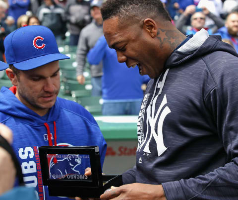 CHICAGO, IL – MAY 05: Aroldis Chapman #54 of the New York Yankees looks over his World Series ring with Miguel Montero #47 of the Chicago Cubs before a game at Wrigley Field on May 5, 2017 in Chicago, Illinois. (Photo by Jonathan Daniel/Getty Images)