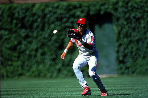 25 Jun 1999: Bobby Abreu #53 of the Philadelphia Phillies catches the ball during the game against the Chicago Cubs at Wrigley Feild in Chicago, Illinois. The Cubs defeated the Phillies 3-2.