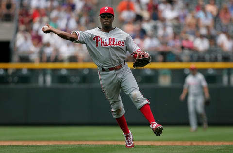 DENVER – JULY 8: Jimmy Rollins #11 of the Philadelphia Phillies makes the throw but is unable to get Kazuo Matsui #7 of the Colorado Rockies at first base for a single in the second inning at Coors Field July 8, 2007 in Denver, Colorado. (Photo by Doug Pensinger/Getty Images)