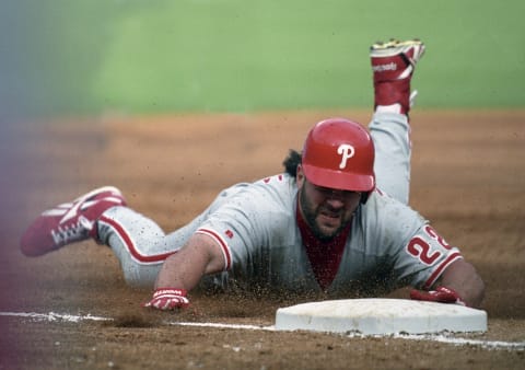 ATLANTA, GA – OCTOBER 11, 1993: Pete Incaviglia #22 of the Philadelphia Phillies slides into third base against the Atlanta Braves during the National League Championship Series Game 5 on October 11,1993 in Atlanta Georgia. (Photo by Ronald C. Modra/Getty Images)