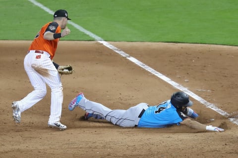 MIAMI, FL – JULY 09: Rhys Hoskins #12 of the Philadelphia Phillies and the U.S. Team tags out Josh Naylor #14 of the San Diego Padres and the World Team in the fifth inning during the SiriusXM All-Star Futures Game at Marlins Park on July 9, 2017 in Miami, Florida. (Photo by Rob Carr/Getty Images)