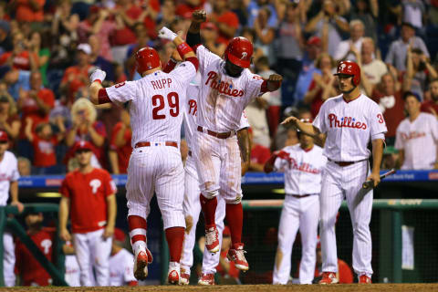 PHILADELPHIA, PA – JULY 22: Cameron Rupp #29 of the Philadelphia Phillies celebrates with Odubel Herrera #37 at home plate after hitting a three-run home run in the eighth inning during a game against the Milwaukee Brewers at Citizens Bank Park on July 22, 2017 in Philadelphia, Pennsylvania. The Brewers won 9-8. (Photo by Hunter Martin/Getty Images)