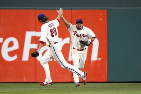 PHILADELPHIA – OCTOBER 10: (L-R) Jayson Werth #28 and Shane Victorino #8 of the Philadelphia Phillies celebrate after Victorino made a catch at the wall for the third out of the top of the seventh inning on a ball hit by Casey Blake #30 of the Los Angeles Dodgers in Game Two of the National League Championship Series during the 2008 MLB playoffs on October 10, 2008 at Citizens Bank Ballpark in Philadelphia, Pennsylvania. (Photo by Jed Jacobsohn/Getty Images)