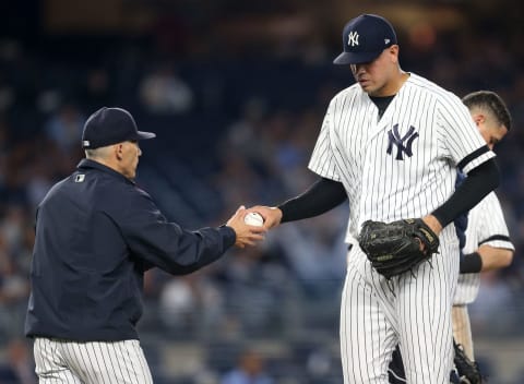 NEW YORK, NY – SEPTEMBER 18: Joe Girardi #28 of the New York Yankees takes the ball from pitcher Dellin Betances #68 in the top of the eighth inning against the Minnesota Twins on September 18, 2017 at Yankee Stadium in the Bronx borough of New York City. (Photo By Christopher Pasatieri/Getty Images)