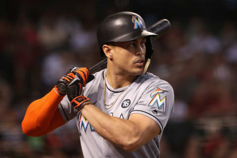 PHOENIX, AZ – SEPTEMBER 24: Giancarlo Stanton #27 of the Miami Marlins warms up on deck during the MLB game against the Arizona Diamondbacks at Chase Field on September 24, 2017 in Phoenix, Arizona. (Photo by Christian Petersen/Getty Images)