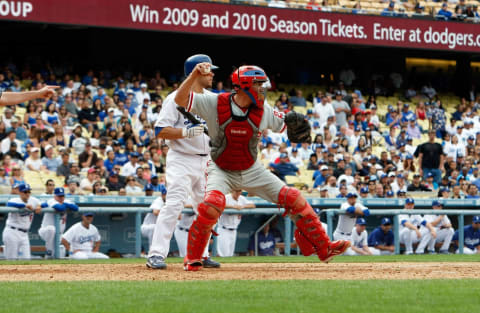 LOS ANGELES, CA – JUNE 06: Chris Coste #27 of the Philadelphia Phillies fields against the Los Angeles Dodgers at Dodger Stadium on June 6, 2009 in Los Angeles, California. The Dodgers defeated the Phillies 3-2 in 12 innings. (Photo by Jeff Gross/Getty Images)