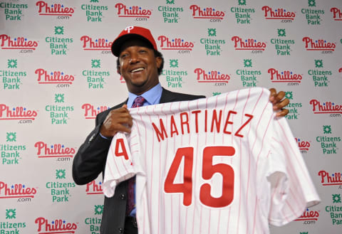 PHILADELPHIA – July 15: The Philadelphia Phillies Pedro Martinez holds up his jersey after joining the team on July 15, 2009 at Citizens Bank Park in Philadelphia, Pennsylvania. (Photo by Drew Hallowell/Getty Images)