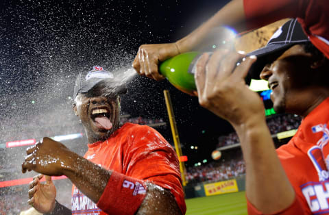 PHILADELPHIA – OCTOBER 21: Ryan Howard #6 of the Philadelphia Phillies is sprayed down with champagne by teammate Pedro Martinez #45 as they celebrate defeating the Los Angeles Dodgers 10-4 to advance to the World Series in Game Five of the NLCS during the 2009 MLB Playoffs at Citizens Bank Park on October 21, 2009, in Philadelphia, Pennsylvania. (Photo by Jeff Zelevansky/Getty Images)