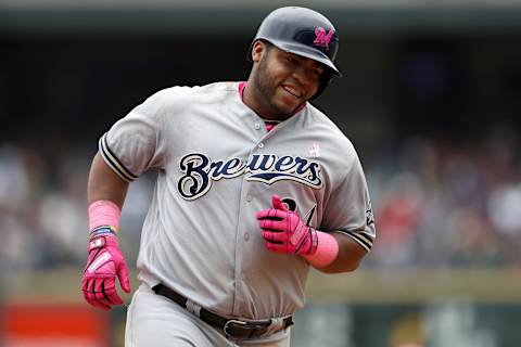 DENVER, CO – MAY 13: Jesus Aguilar #24 of the Milwaukee Brewers circles the bases after hitting a 3 RBI home run in the sixth inning against the Colorado Rockies at Coors Field on May 13, 2018 in Denver, Colorado. (Photo by Matthew Stockman/Getty Images)