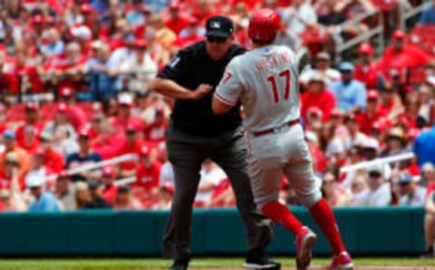 ST. LOUIS, MO – MAY 19: Rhys Hoskins #17 of the Philadelphia Phillies runs into umpire Larry Vanover #27 as he rounds first base against the St. Louis Cardinals in the first inning at Busch Stadium on May 19, 2018 in St. Louis, Missouri. (Photo by Dilip Vishwanat/Getty Images)