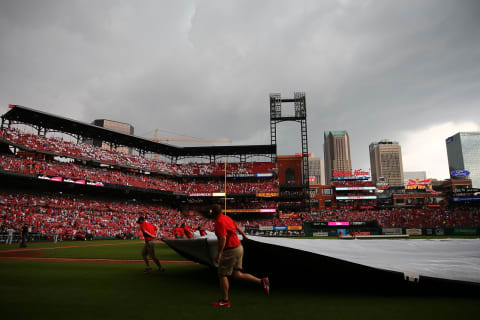 ST. LOUIS, MO – MAY 19: Members of the grounds crew pull the tarp over the infield in the fifth inning during a game between the St. Louis Cardinals and the Philadelphia Phillies at Busch Stadium on May 19, 2018 in St. Louis, Missouri. (Photo by Dilip Vishwanat/Getty Images)