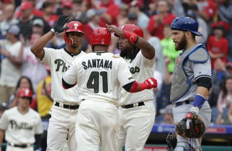 PHILADELPHIA, PA – MAY 27: Carlos Santana #41 of the Philadelphia Phillies is greeted at home plate by Maikel Franco #7 and Nick Williams #5 after scoring a run in the sixth inning during a game against the Toronto Blue Jays at Citizens Bank Park on May 27, 2018 in Philadelphia, Pennsylvania. The Blue Jays won 5-3. (Photo by Hunter Martin/Getty Images)