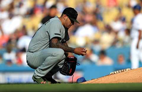 LOS ANGELES, CA – MAY 28: Vince Velasquez #28 of the Philadelphia Phillies checks the ball during the first inning of a game against the Los Angeles Dodgers at Dodger Stadium on May 28, 2018 in Los Angeles, California. MLB players across the league are wearing special uniforms to commemorate Memorial Day. (Photo by Sean M. Haffey/Getty Images)