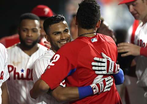 PHILADELPHIA, PA – JUNE 13: Jesmuel Valentin #9 of the Philadelphia Phillies smiles as he gets a hug from J.P. Crawford #2 after hitting his first career home run in the ninth inning during a game against the Colorado Rockies at Citizens Bank Park on June 13, 2018 in Philadelphia, Pennsylvania. The Rockies won 7-2. (Photo by Hunter Martin/Getty Images)