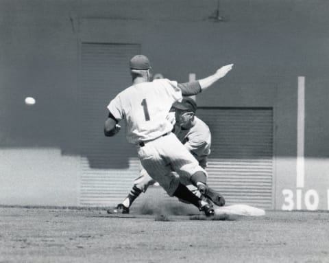 NEW YORK – 1962: Richie Ashburn #1 of the New York Mets slides into second base as Julian Javier #25 of the St. Louis Cardinals awaits the throw during a game in the 1962 season at the Polo Grounds in New York City.. (Photo by Robert Riger/Getty Images)