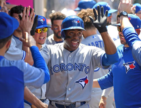 ANAHEIM, CA – JUNE 24: Curtis Granderson #18 of the Toronto Blue Jays is congratulated in the dugout after hitting a solo home run in the sixth inning of the game against the Los Angeles Angels of Anaheim at Angel Stadium on June 24, 2018 in Anaheim, California. (Photo by Jayne Kamin-Oncea/Getty Images)