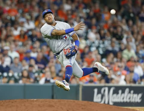 HOUSTON, TX – JUNE 27: Yangervis Solarte #26 of the Toronto Blue Jays throws after fielding a slow rolling ground ball off the bat of Jose Altuve of the Houston Astros in the seventh inning at Minute Maid Park on June 27, 2018 in Houston, Texas. Altuve was safe on the play. (Photo by Bob Levey/Getty Images)